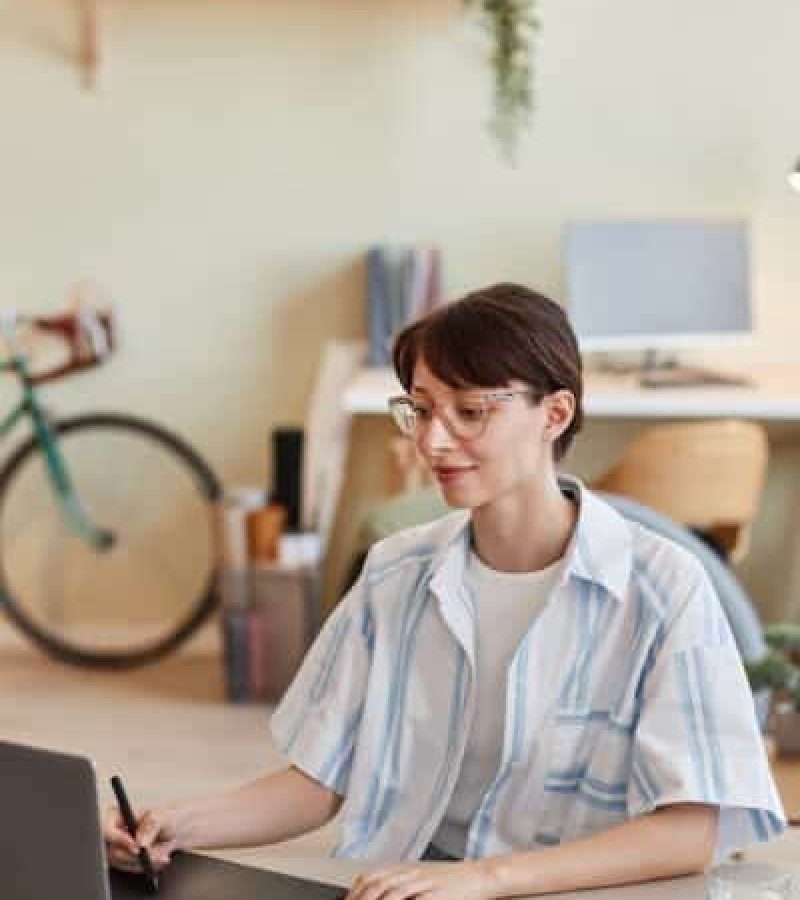 Young woman using pen tablet for digital design Young woman using pen tablet for digital design